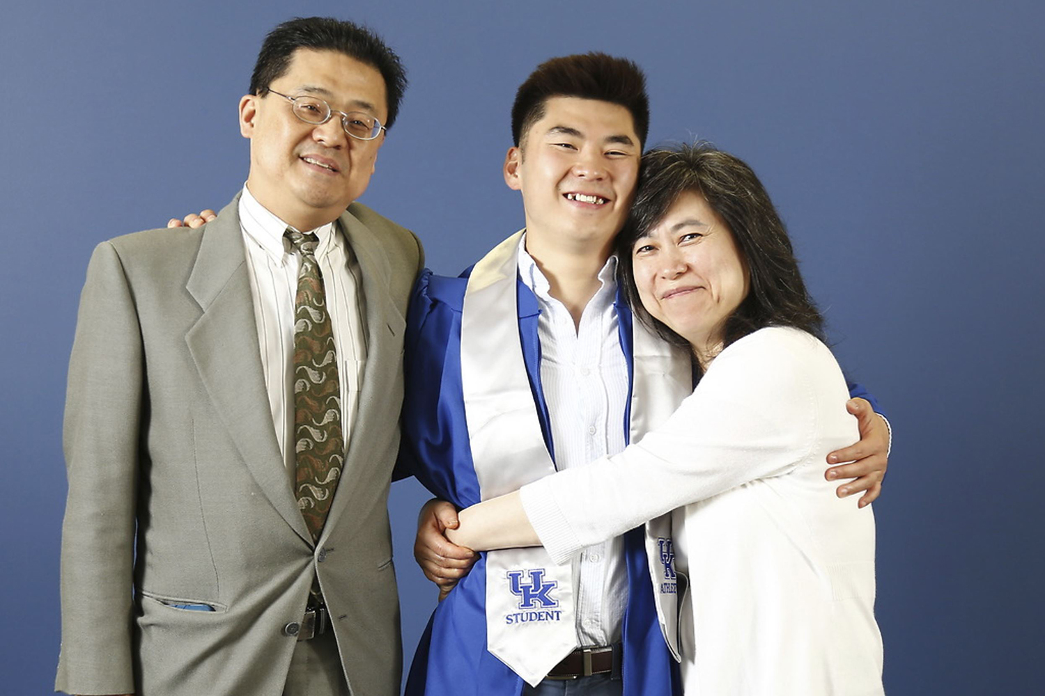 family-hugging-graduate
